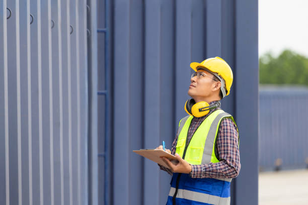 istock Engineer man with clipboard checklist, Industrial worker in industry containers cargo 2151077440
