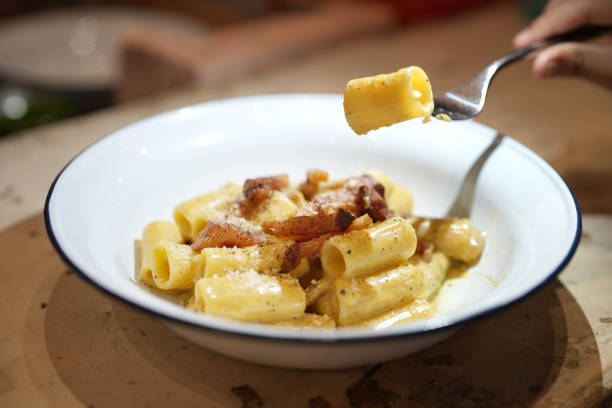 Creamy pasta with bacon served in a plate