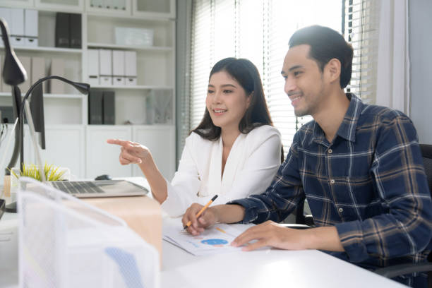 istock Asian business team is analyzing document data in meeting. 2151077769