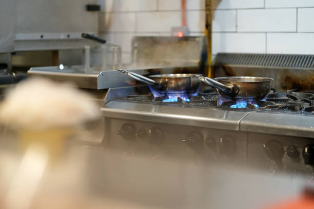Food cooking on stove in kitchen at restaurant