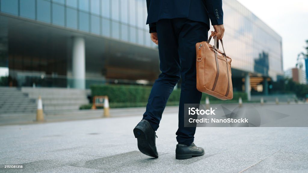 Closeup of business man leg walking while holding bag. Back view. Exultant. Closeup of skilled business man leg walking while holding bag. Cropped image of project manager focus on leg. Traveling, moving, journey, getting a new position, job changing. Back view. Exultant. Adults Only Stock Photo Closeup of business man leg walking while holding bag. Back view. Exultant. Closeup of skilled business man leg walking while holding bag. Cropped image of project manager focus on leg. Traveling, moving, journey, getting a new position, job changing. Back view. Exultant. Adults Only Stock Photo