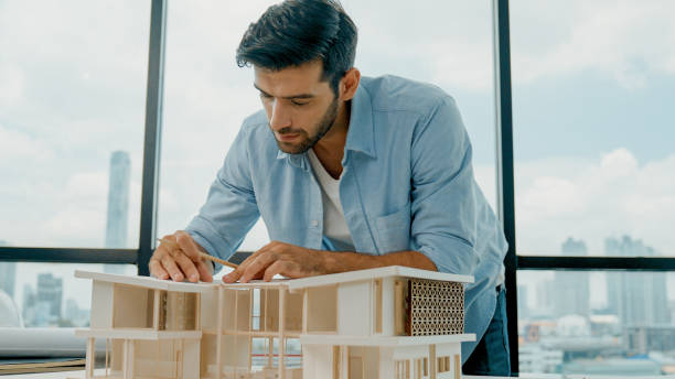 istock Civil engineer measure house model while check, inspect model. Tracery 2151081446