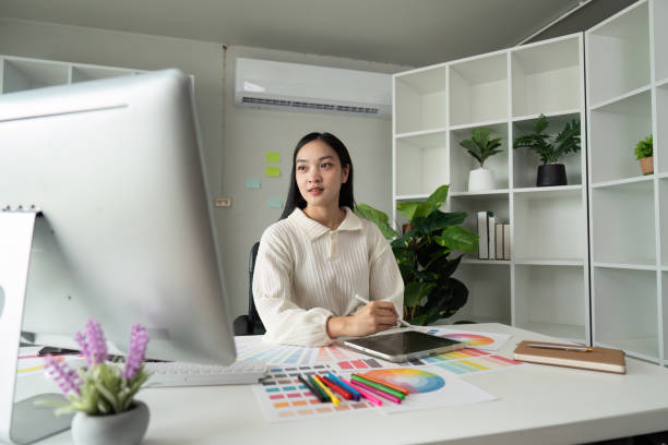 istock Graphic or UI designer work on computer laptop and with tablet after brainstorming unique design with professional developer UX team 2151083842