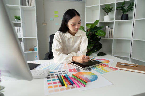 istock Graphic or UI designer work on computer laptop and with tablet after brainstorming unique design with professional developer UX team 2151083859