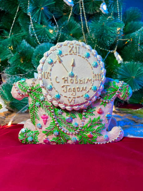 istock Festive New Year's Celebration Gingerbread Clock. A Handcrafted Edible Decoration Symbolizing the Countdown to the Holiday 2151083946