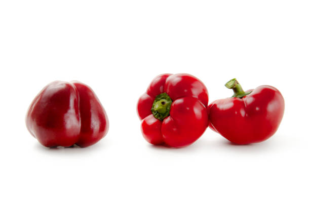 istock Three red bell pepper isolated on white background with clipping path. 2151084067
