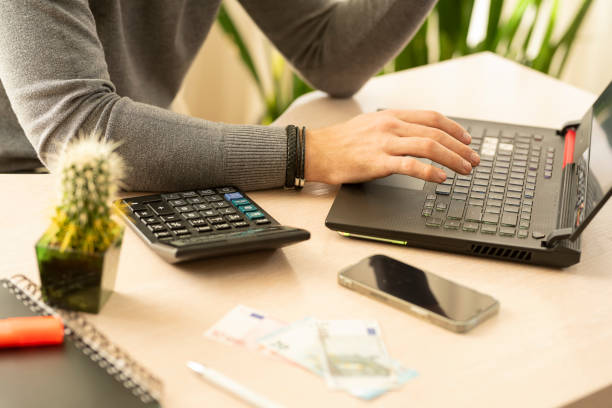istock A man works on a laptop at his workplace. 2151085469