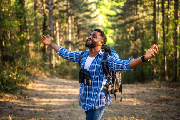 istock Hiker with arms raised enjoys in nature 2151085561