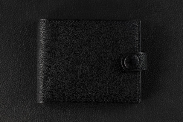 Black leather wallet. A wallet with credit cards.