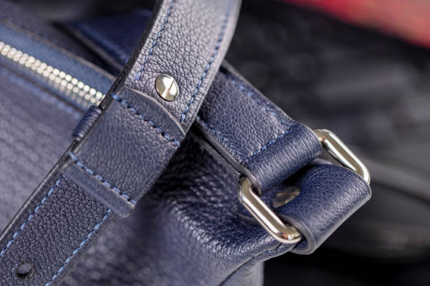 istock Part of a blue leather bag on a black background. Leather goods. 2151087631