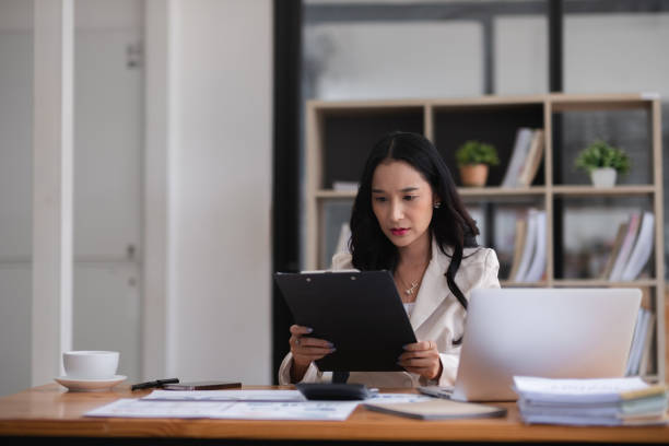 istock Young businesswoman has problems with her work in the office Feeling stressed and unhappy, showing a serious expression 2151088161