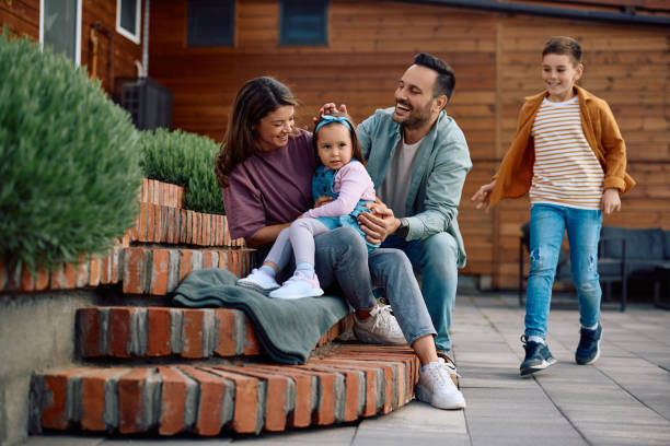 istock Happy family enjoying while spending a day together in their backyard. 2151088736