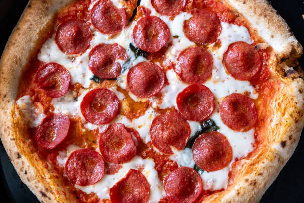istock italian pizza in oven on rotating 2151089174