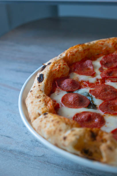 istock italian pizza in oven on rotating 2151089289