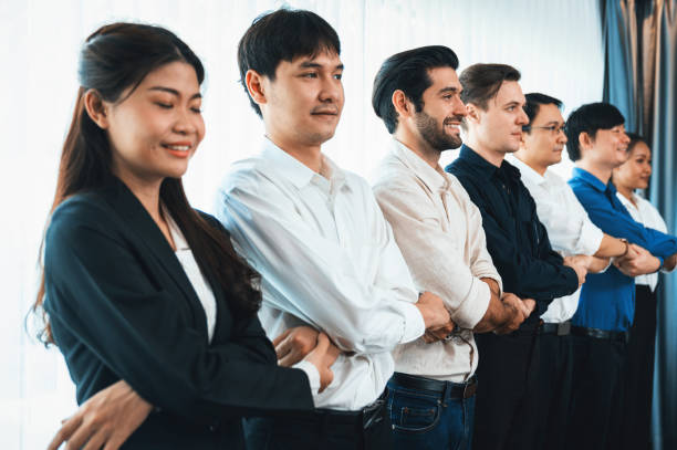 istock Business team standing, join and link hand together. Prudent 2151089670