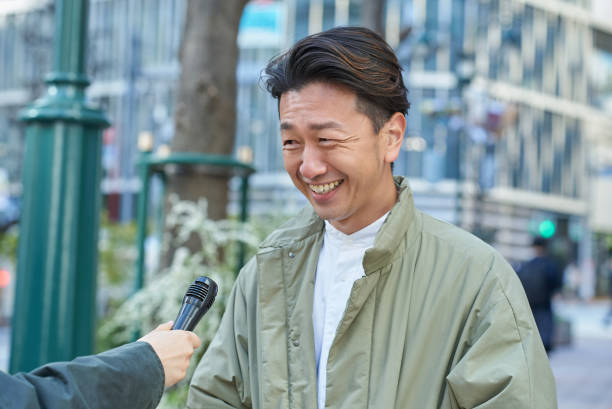 istock A man being interviewed on the street 2151089878