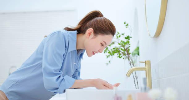 istock asian woman wash face happy 2151090171