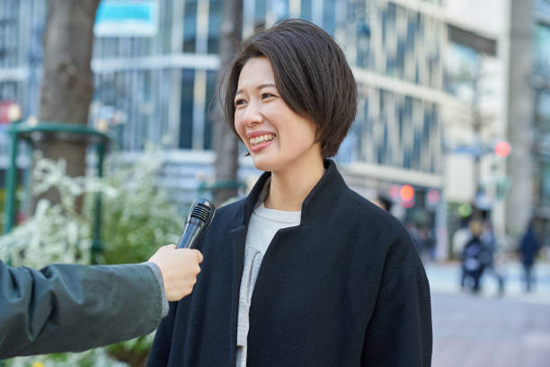 A woman being interviewed on the street