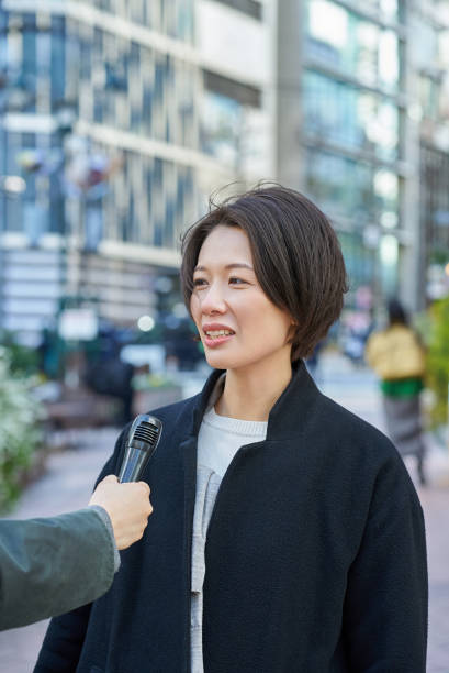 istock A woman being interviewed on the street 2151090501