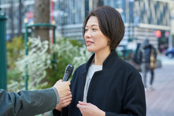 istock A woman being interviewed on the street 2151090601