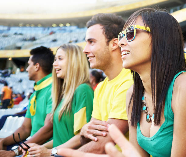 istock Happy sports fans watching a match 2151090943