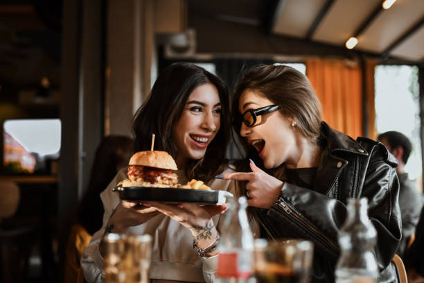 istock Surprise Burger For Beautiful Female From Her Girlfriend 2151091149