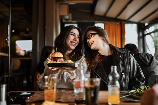 istock Lesbian Females And Their Burger Dinner 2151091183