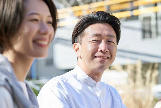 istock A man looking at a woman with a kind expression outdoors 2151092204