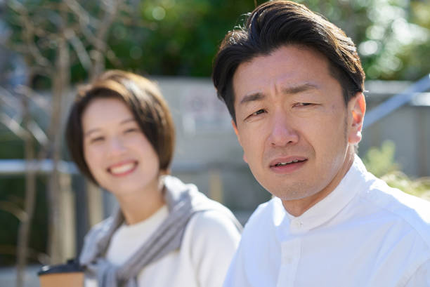 istock A man looking displeased next to a woman 2151092254