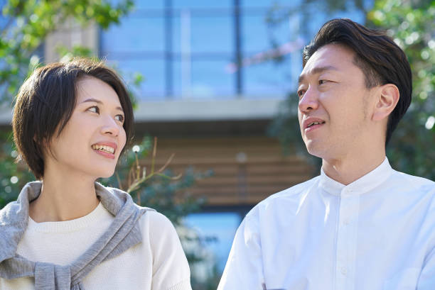 istock Man and woman talking intimately 2151092418