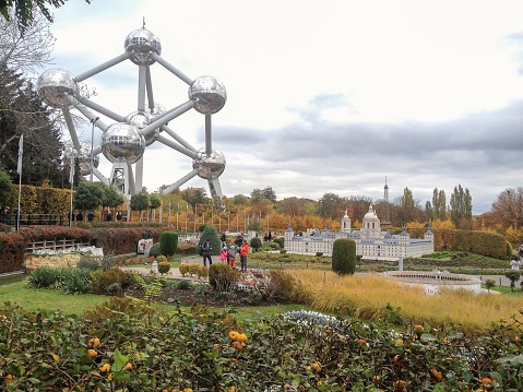 Mini Europe, Brussels, Belgium.10.27.15. Park with miniatures of different iconic European buildings. In the background the Atomium, a monument inaugurated in Expo58. Brussels tourist attractions.