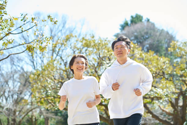 istock Man and woman running side by side 2151093568