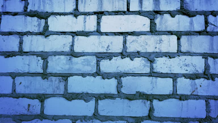 Brick wall closeup with blue lighting