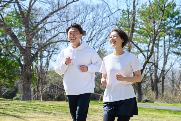 istock Man and woman running side by side 2151093865