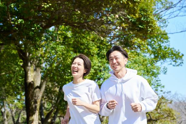 istock Man and woman running side by side 2151093890
