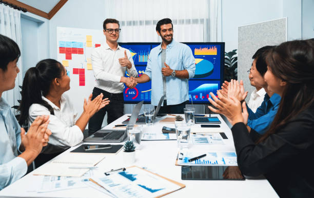 istock Analyst team leader shake hand with colleague after successful meeting. Prudent 2151094103