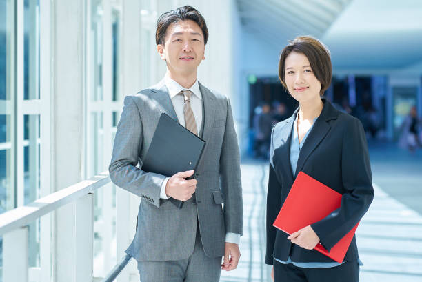 istock Man and woman in suits 2151094894