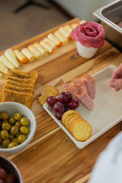 istock The beautiful chef prepares a cheese board from her home kitchen 2151094932