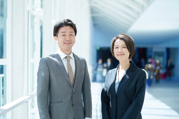 istock Man and woman in suits 2151094994