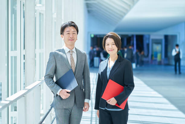 istock Man and woman in suits 2151095102