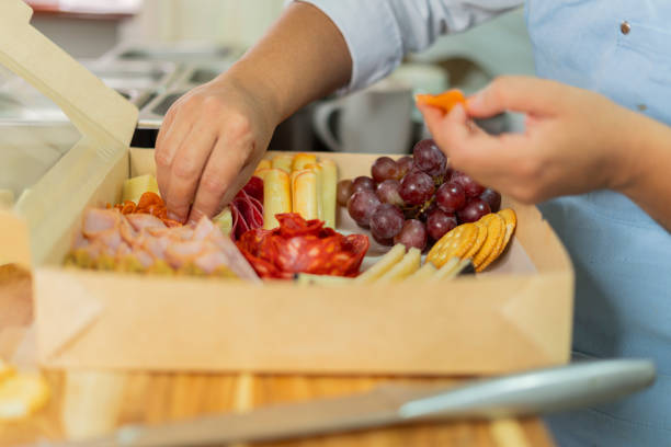 istock The beautiful chef prepares a cheese board from her home kitchen 2151095600