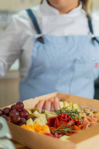 istock The beautiful chef prepares a cheese board from her home kitchen 2151095646