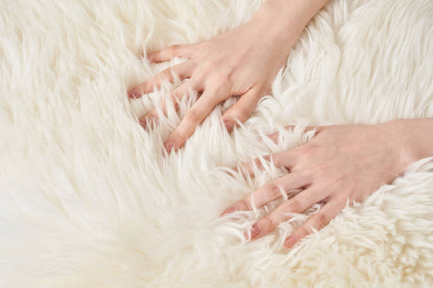 istock A hand touches the fluffy fabric 2151097698