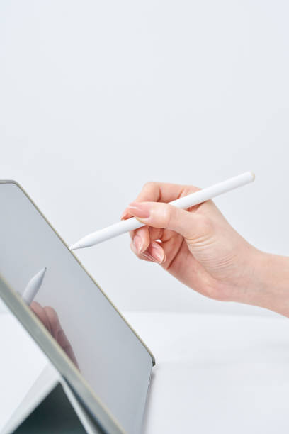 istock a woman operating a stylus pen 2151098139