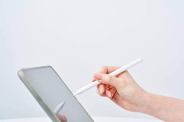 istock a woman operating a stylus pen 2151098176