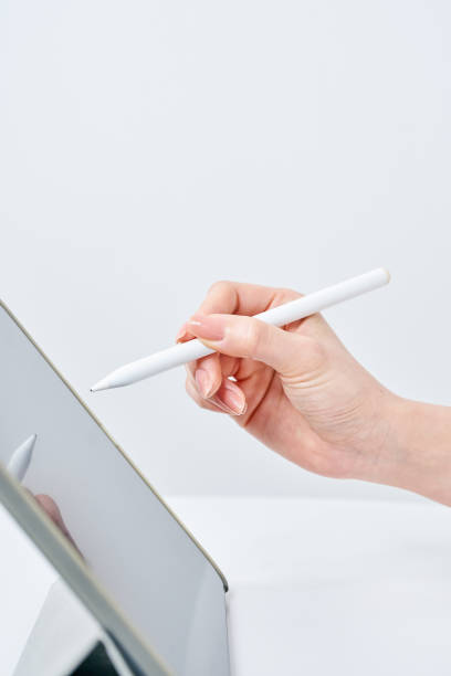 istock a woman operating a stylus pen 2151098194