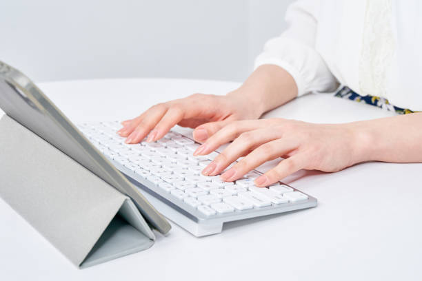 istock a woman typing on a keyboard 2151098266