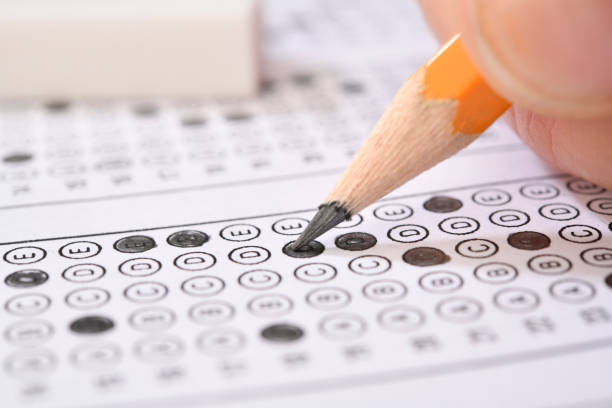 istock Filling answers of multiple choice examination close-up 2151099954