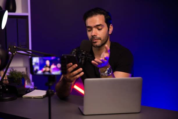 istock Broadcaster talking to listener on live streaming with blurred screen. Surmise. 2151100140