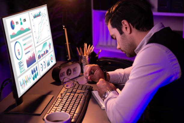 istock Smart businessman writing memo market data on paper work. Surmise. 2151101461